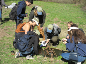 Students survey aquatic life in wildlife drinker